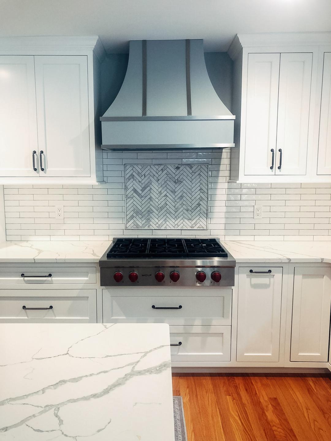 bright white cabinetry grey fixtures and appliances