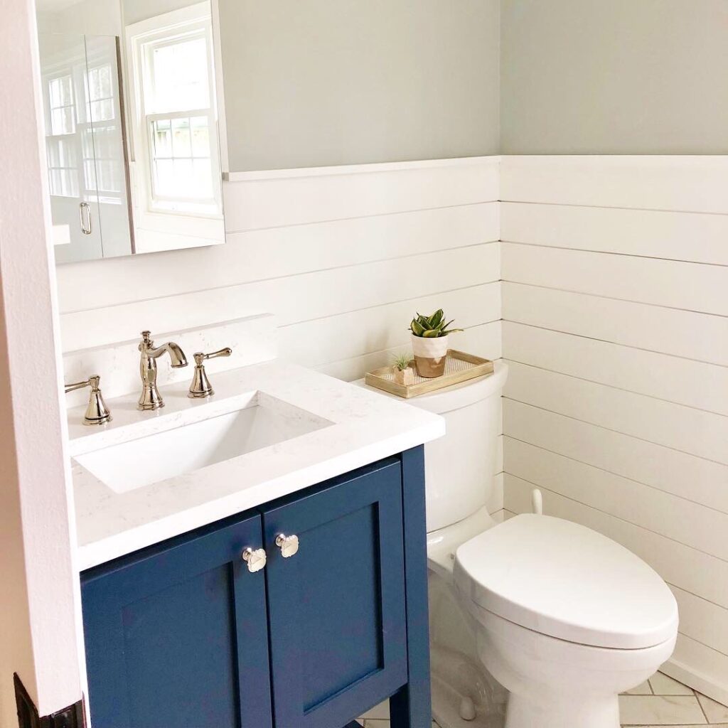 Small Bathroom For Guest Suite White Shiplap Blue and Gold Accents
